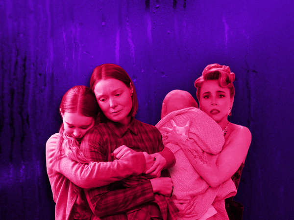 Three women lit in pink-red tones against a purple background; one hugs a child, another holds a baby wrapped in a towel.